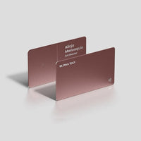 Rose gold metal business cards with NFC tap symbol, sleek design for professionals