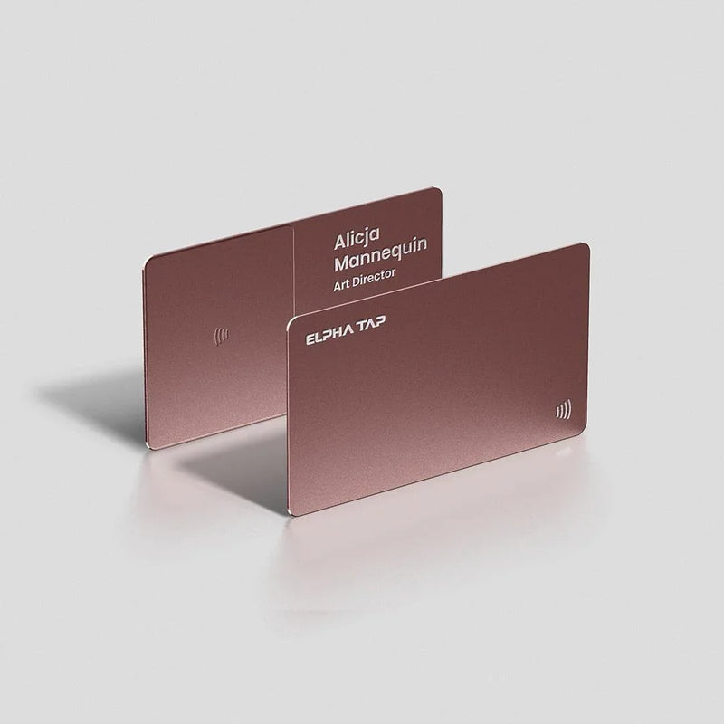 Rose gold metal business cards with NFC tap symbol, sleek design for professionals