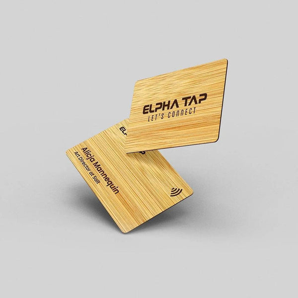 Elegant wooden business cards with engraved text and NFC symbol, modern professional design
