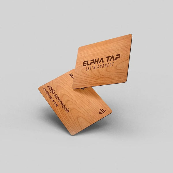 Wooden business cards with engraved text and NFC symbol, modern professional design