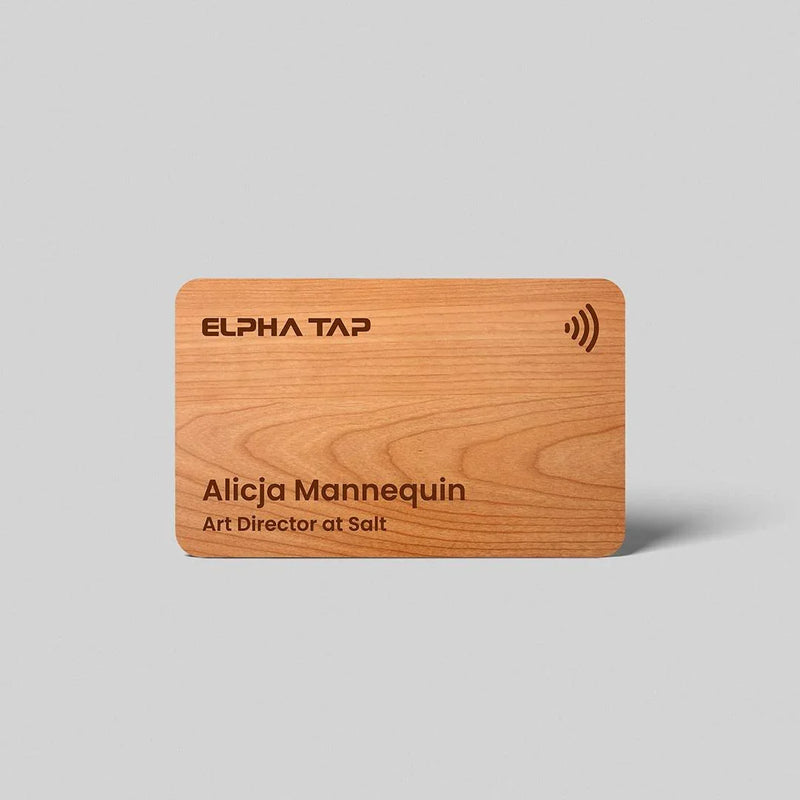 Wooden business card with engraved name, title, and contactless symbol, premium design for professionals