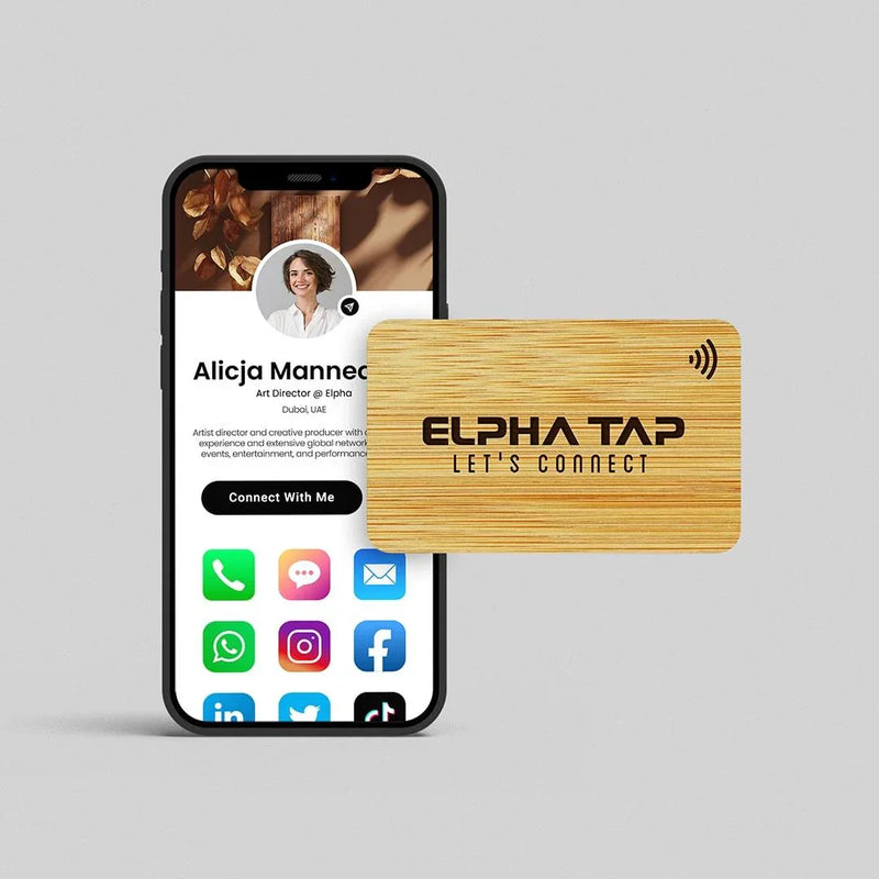 Wooden Elpha Tap NFC business card with smartphone displaying digital profile and social links