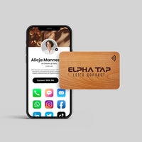 Wooden Alpha Tap NFC business card with smartphone displaying digital profile, UAE contact options