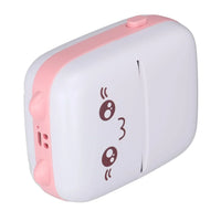 Pink and white portable baby bottle warmer with cute face design, compact travel-friendly heater
